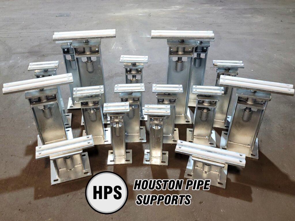 group of adjustable pipe supports with half rounds